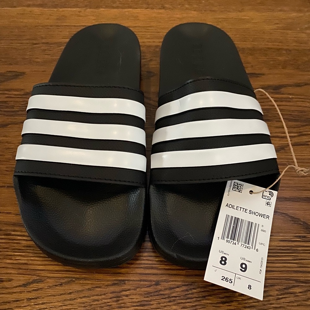 Adidas slides.  Brand new! Great for beach, shower shoes, house slides.